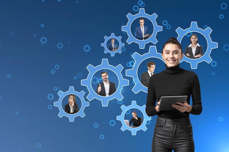 Fotoğraf smiling young businesswoman with tablet and creative cogwheels with happy european businesspeople inside on blue background teamwork and business mechanism system