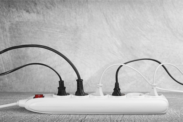Socket strip and connected plugs on desk
