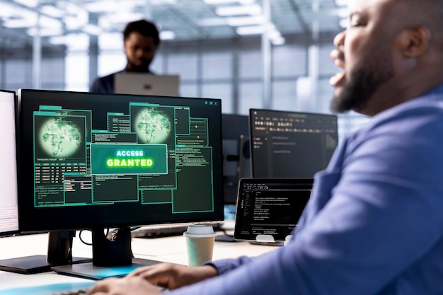 software developer in data center getting access granted notification on pc