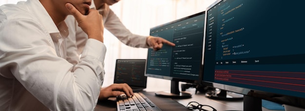 software development team working together in office coding script display on computer monitor programmer and software engineer working in tech developer company trailblazing