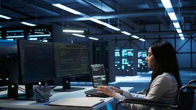System administrator overseeing data center using green screen computer