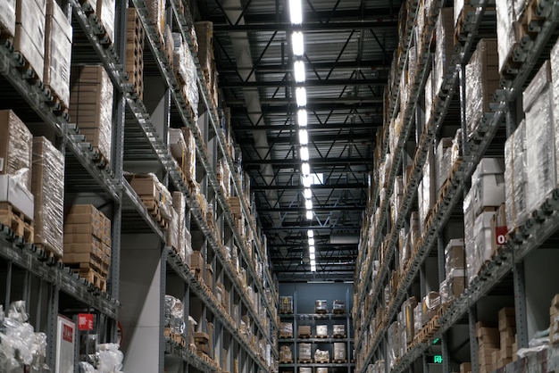 The warehouse full of goods boxes and shelves Industrial concept background