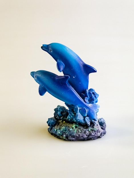 Two blue dolphins Figurine on a white background