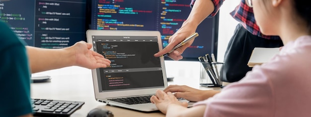 Two smart computer engineers working together to solve program code Burgeoning