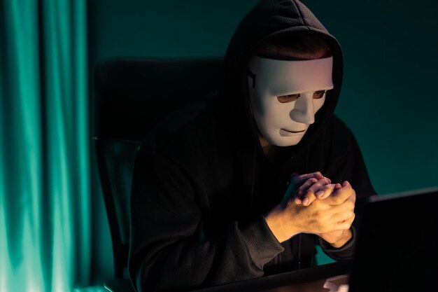 White criminal anonymous mask installing coding password encryption Pecuniary