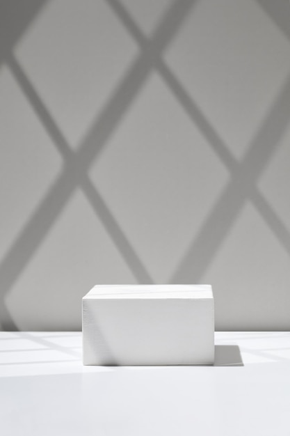 white empty podium on white background display gray wall template for advertising window shadow