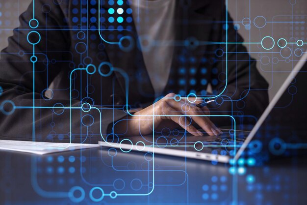 Woman typing the keyboard to create innovative software to change the world and provide a completely new service Close up shot Hologram tech graphs Concept of Dev team Formal wear