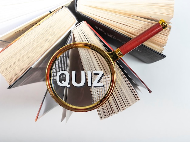 Word quiz through magnifying glass on books
