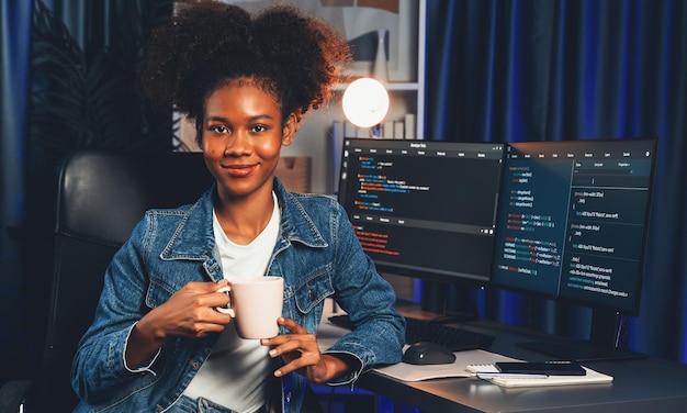 Young African IT developer presenting program and focus on camera Tastemaker