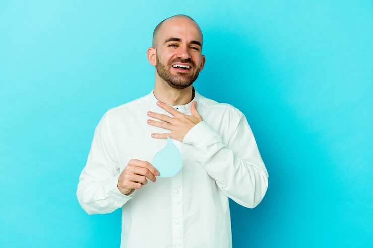 Fotoğraf young caucasian bald man celebrating world water day isolated on blue background