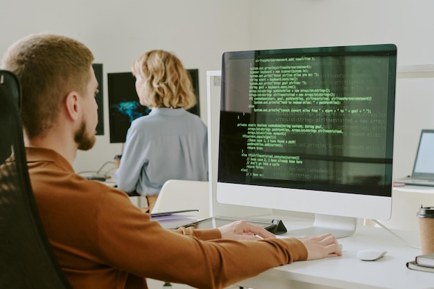 young man testing cybersecurity system at work