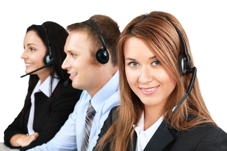 Fotoğraf young workers using a headset - isolated