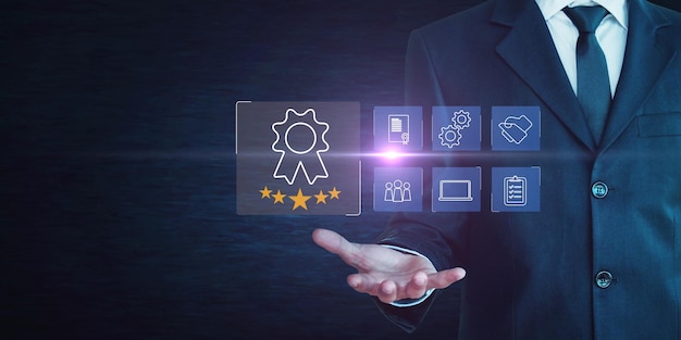 a man in a suit holds a tablet with a blue logo on it