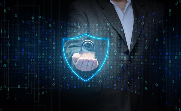A man with a metal lock stands in front of a virtual screen with a binary code Data verification device and network control Data protection search for information leakage