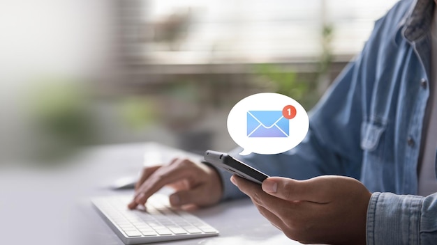 A person interacts with email notifications on a smartphone indicating active communication and digital connectivity