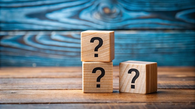 a row of wooden blocks with question marks on them
