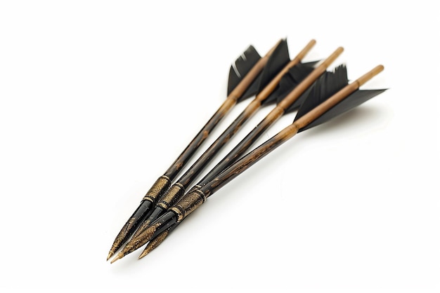 a set of wooden arrows with a black pen on top of it