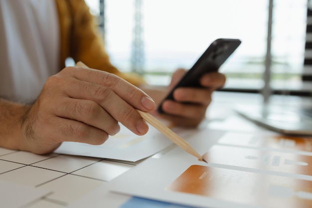 A web developer as a User Experience and User Interface Officer is analyzing data from his ideas to develop the structure and components of a digital product ux ui interface experience