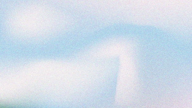 Abstract Blurred grainy texture and teal to white to brown gradient Light blue grainy