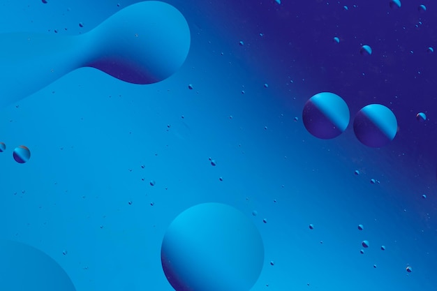 abstract composition of blue shapes and bubbles forming smooth flowing pattern reminiscent of tranquil liquid scene