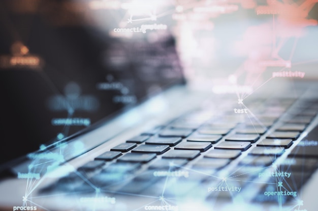 abstract technology background with digital display and laptop keyboard double exposure