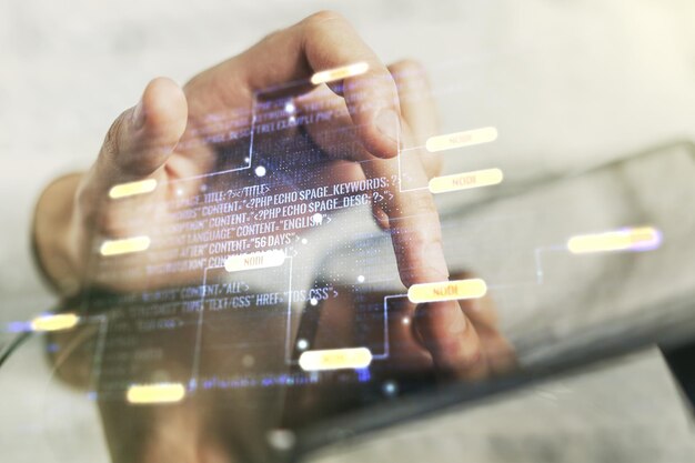 Abstrakti luova koodauskonsepti sormen klikkauksilla digitaalisella tabletilla taustalla, monivalotus
