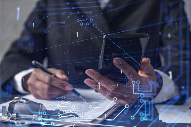 African American businesswoman is signing the contract to create a start up for the conference and gain investments for innovative service Checking the details at smartphone Hologram tech graphs