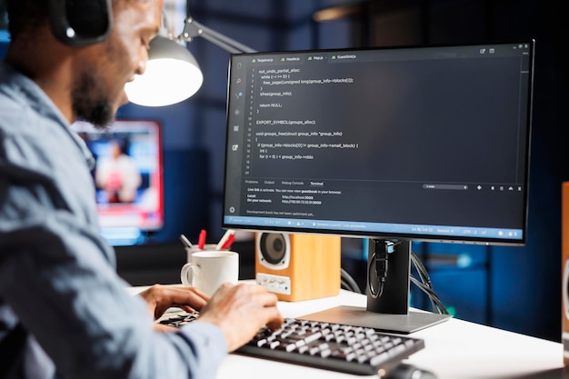 African american internet programmer writes server code