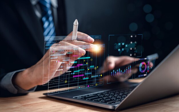 Analyst working with computer in Business Analytics and Data Management System to make report with KPI and metrics connected to database