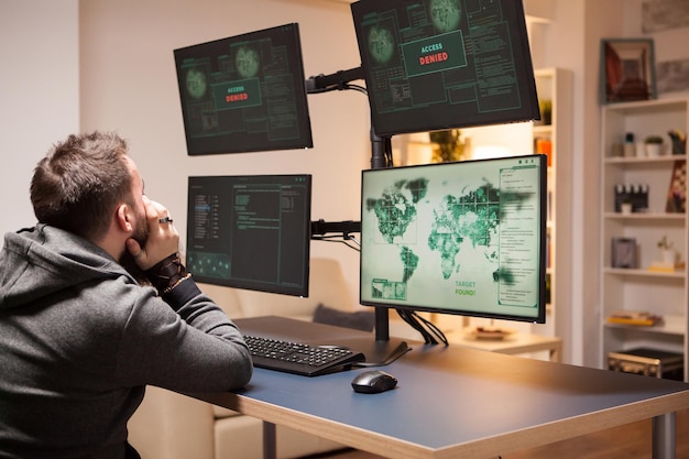 angry hacker covering his face because couldn't hack government main server. access denied.