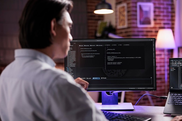 App programmer using binary code to script security system, programming firewall encryption. Working with program data server to develop network on coding software, using advanced app interface.