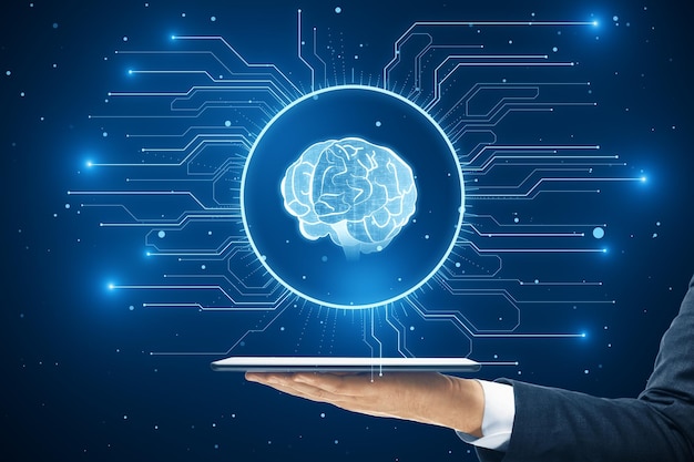 artificial intelligence and deep learning technology concept with hand holding digital tablet and human brain icon virtual hologram on dark blue background