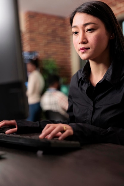 Asian system administrator upgrading firewall system in order to maintain security stability. Application developer encrypting cloud storage database by updating network algorithm.