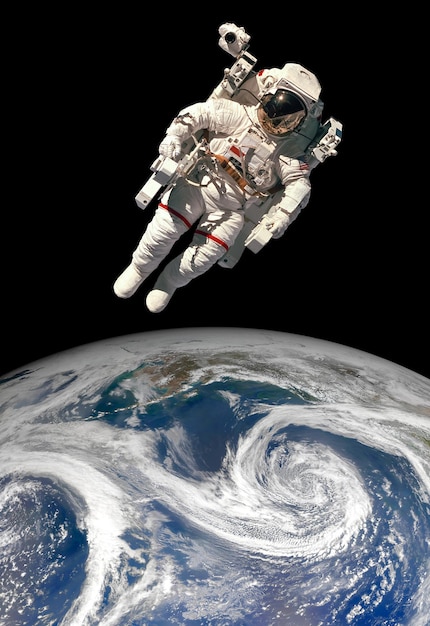 Astronaut in outer space against the backdrop of the planet earth. Elements of this image furnished by NASA.