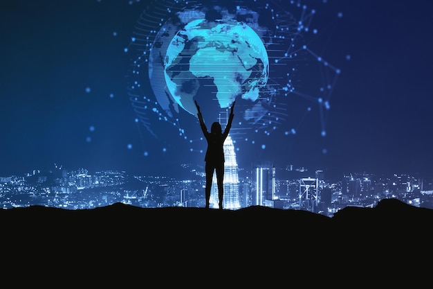 Backlit businesswoman holding glowing earth hologram on dark night city background Global innovation and digital transformation concept