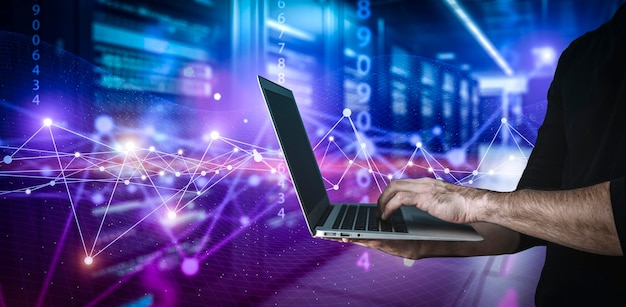 Big data technology background Using a laptop against the background of visualization of a computer internet network social connection analytics information
