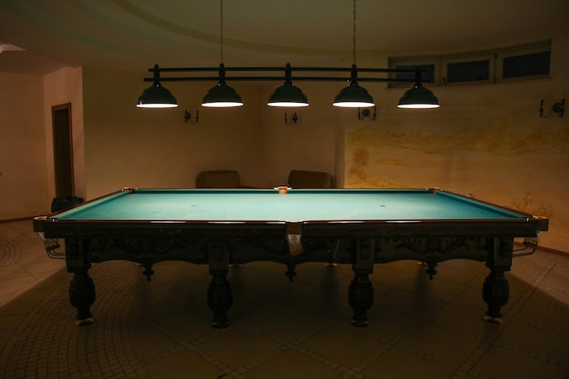 billiard table in a dark room