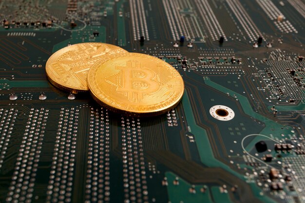 Bit coins on the background of a computer microcircuit