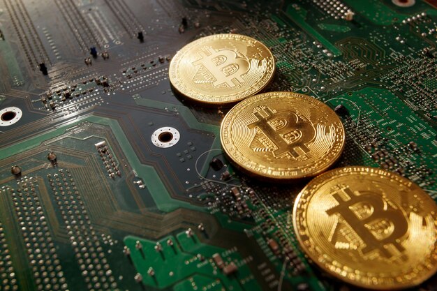 Bit coins on the background of a computer microcircuit