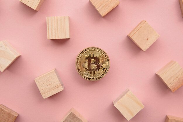 Bitcoin cryptocurrency coin blockchain technology concept coin with wood block