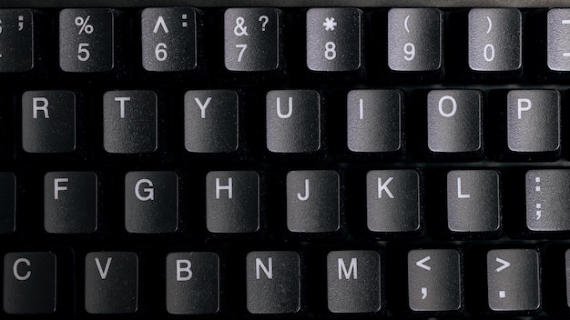 Black computer keyboard keys close up background