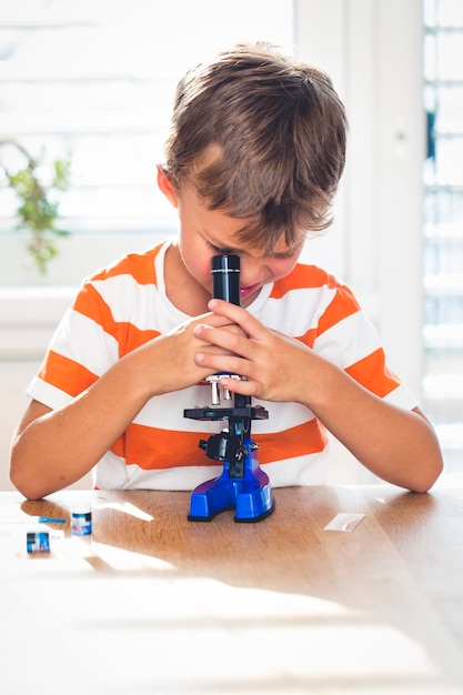 Boy doing science experiment at home