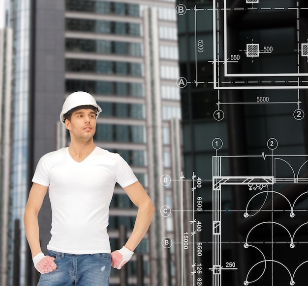 building, developing, consrtuction, architecture concept - handsome builder in white helmet