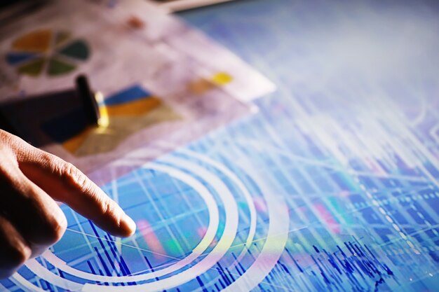 business concept. information technology and data processing. hands over the screen with graphic data. a modern software product in business.