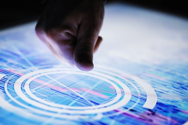 business concept. information technology and data processing. hands over the screen with graphic data. a modern software product in business.