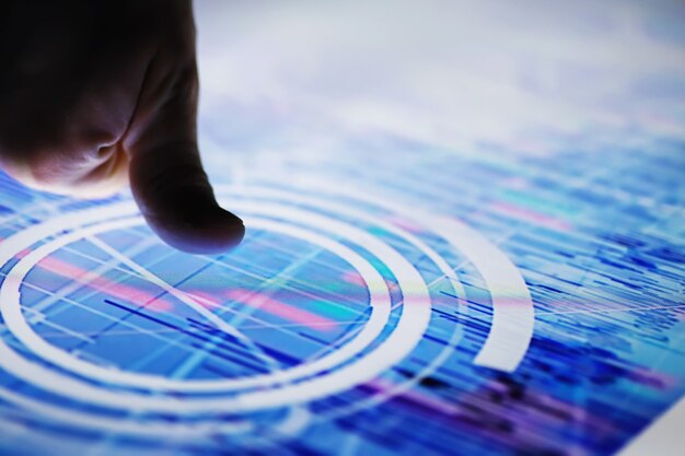business concept. information technology and data processing. hands over the screen with graphic data. a modern software product in business.