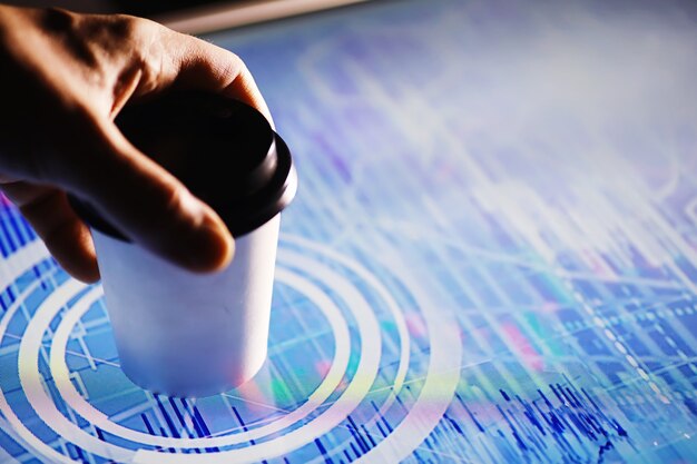 business concept. information technology and data processing. hands over the screen with graphic data. a modern software product in business.