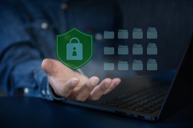 Business man work with laptop seek data folder are locking icon floating on screen