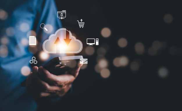 Business people hold smartphones with virtual glowing cloud computing to download and load data information and upload on system network applications Technology data transformation data transfer