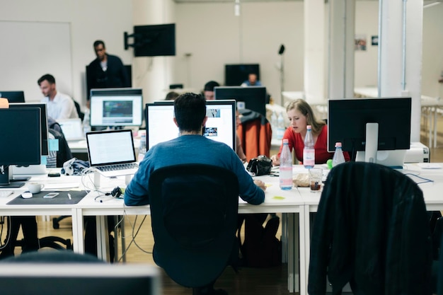 business people using computers in office